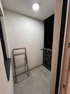 a room with a walk in closet and a door with a cart at Krfska Lux by Magenta in Belgrade