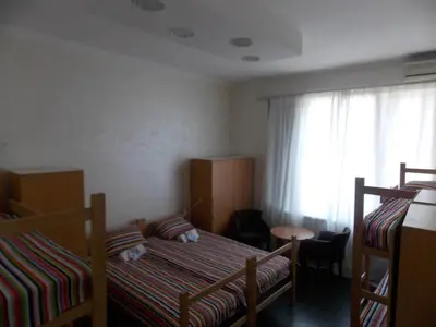a bedroom with two bunk beds and a window at Guest House Miss Depolo in Belgrade