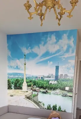 a room with a mural of the statue of liberty at Dream apartment Beograd in Belgrade