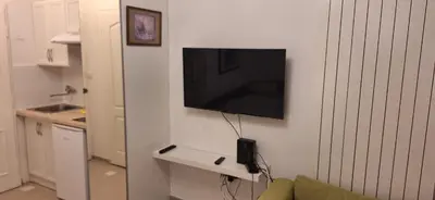 a flat screen tv hanging on a wall at Dream apartment Beograd in Belgrade
