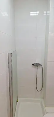 a shower with a glass door in a bathroom at Dream apartment Beograd in Belgrade