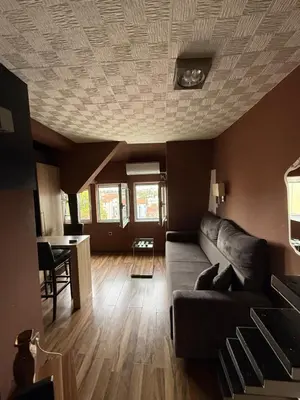 a living room with a couch and a table at Bann1 in Belgrade