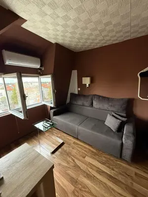 a living room with a couch and a table at Bann1 in Belgrade