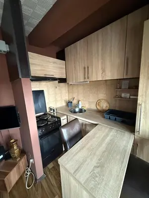 a small kitchen with a stove and a sink at Bann1 in Belgrade