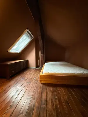 a small room with a bed and a window at Bann1 in Belgrade