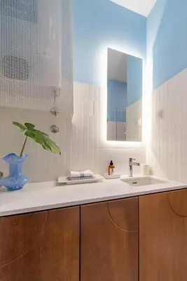 a bathroom with a sink and a mirror at Chic NEW IvoLola Studio YU modern design gem in Belgrade