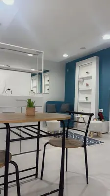 a dining room with a table and chairs at Modern studio in center of Belgrade in Belgrade