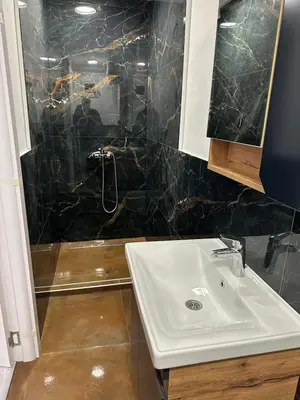 a bathroom with a sink and a shower at Modern studio in center of Belgrade in Belgrade