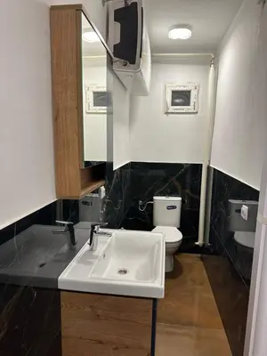 a bathroom with a sink and a toilet at Modern studio in center of Belgrade in Belgrade