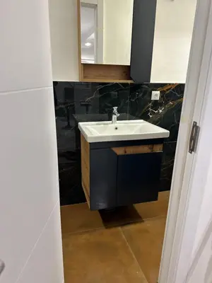 a bathroom with a sink and a mirror at Modern studio in center of Belgrade in Belgrade