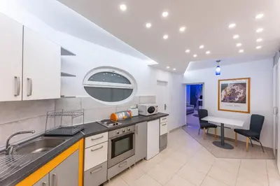 a kitchen with a sink and a counter top at Dove's Nook - A Stylish City Center Retreat in Belgrade