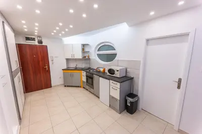 a kitchen with a sink and a counter top at Dove's Nook - A Stylish City Center Retreat in Belgrade