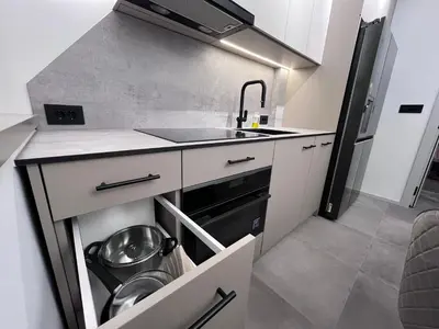 a kitchen with a sink and a dishwasher at Urban Central Oasis in Belgrade