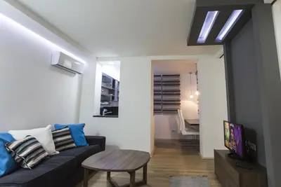 a living room with a couch and a table at Apartment Nevena in Belgrade