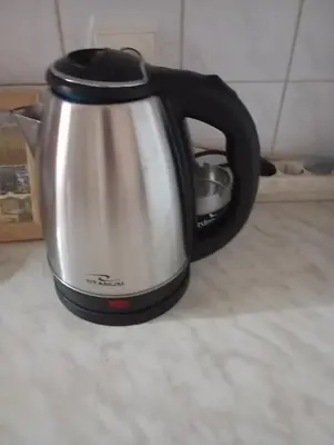 a black and white tea kettle sitting on a counter at Natali apartment in Belgrade