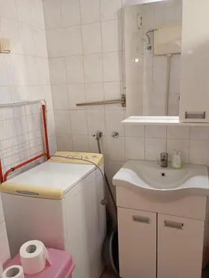 a small bathroom with a sink and a toilet at Natali apartment in Belgrade