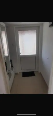 a white room with a window and a door at Apartman- Ledine in Ledine