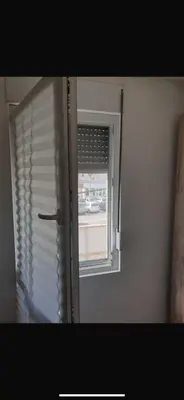 a window with the blinds open in a room at Apartman- Ledine in Ledine