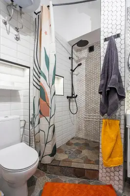 a bathroom with a toilet and a shower at Black & White Delight in Belgrade