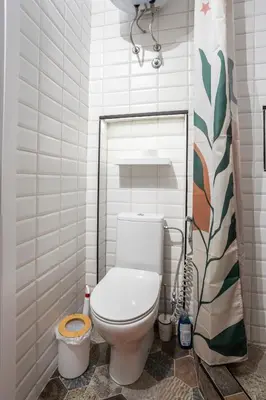 a bathroom with a white toilet in a room at Black & White Delight in Belgrade