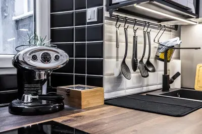 a kitchen counter with a mixer and utensils at Elegant, Chique & Spacious Boho Loft in Belgrade