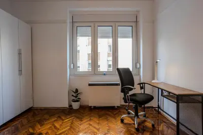 an empty office with a desk and a chair at Elegant, Chique & Spacious Boho Loft in Belgrade