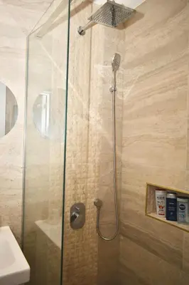 a shower with a glass door in a bathroom at Studio Ramonda - City Center Dorcol - with Free Parking in Belgrade