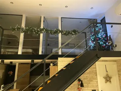 a christmas tree on the stairs of a house at Ritual splav in Belgrade