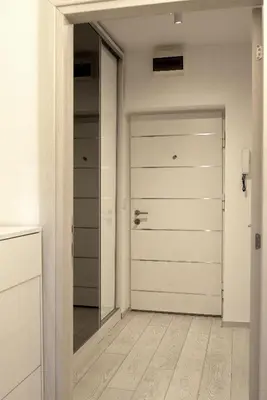 a hallway with a door and a mirror at Heart of Belgrade in Belgrade