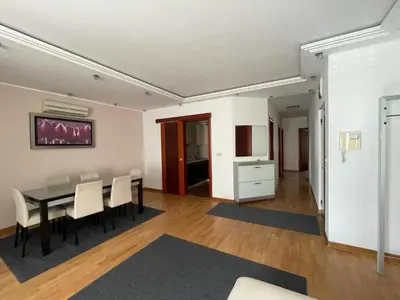 a dining room with a table and chairs at Ninis city flat in Belgrade