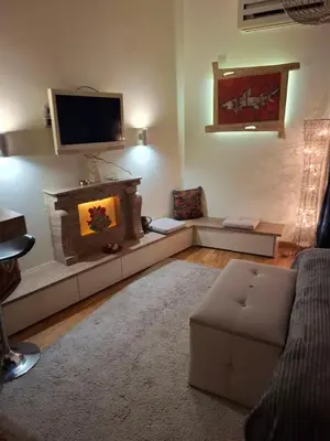 a living room with a couch and a tv at Dečanska studio in Belgrade