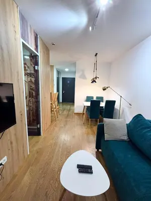 a living room with a couch and a table at Exing Prime 65 New Belgrade in Belgrade