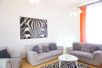 a living room with two couches and a table at 2 BDR NEW Wake up in Belgrade for 5 in Belgrade