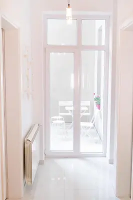 a white room with a window and a table at 2 BDR NEW Wake up in Belgrade for 5 in Belgrade