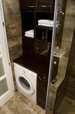 a washer and dryer in a bathroom at Crown Apartment - Your Royal Stay in Belgrade