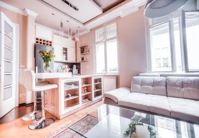a living room with a couch and a table at Crown Apartment - Your Royal Stay in Belgrade