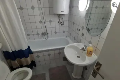 a bathroom with a sink and a toilet and a tub at Konza1 in Belgrade