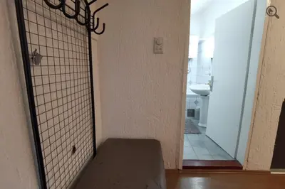 a room with a gate with a toilet in a bathroom at Konza1 in Belgrade