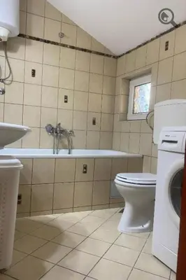a bathroom with a toilet and a tub and a sink at Konza 2 in Belgrade