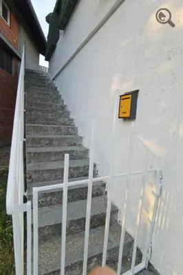 a set of stairs next to a white building at Konza 2 in Belgrade