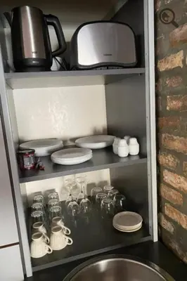 a kitchen cabinet with a sink and a microwave at Konza 2 in Belgrade