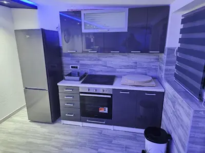 a kitchen with a stove and a refrigerator at Rabit delux I in Belgrade