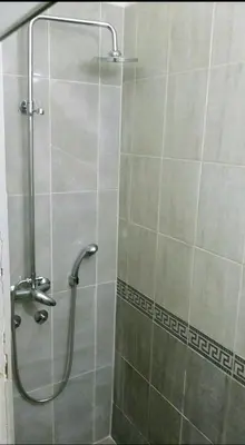 a shower with a glass door in a bathroom at Rooms & Apartments Miavik in Belgrade