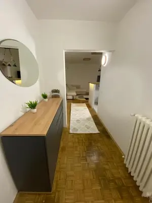 a bathroom with a wooden counter and a mirror at Prestige in Belgrade