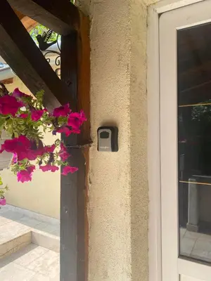 a door with a mailbox on the side of a house at Apartman Malena in Belgrade