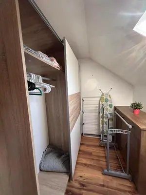 a tiny house with a staircase in the attic at Apartman Malena in Belgrade
