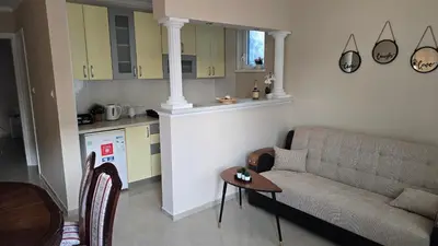 a living room with a couch and a table at Warm Nest in Belgrade