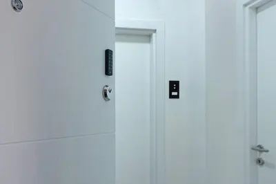 a white door in a bathroom with a shower at Apartment Paradise Flora Centar in Belgrade