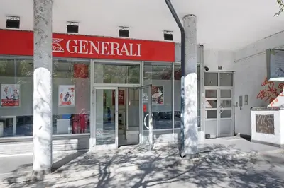 a store front with a red sign on the front at Apartment Paradise Flora Centar in Belgrade