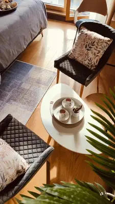 a living room with a table and a chair at Residence in Belgrade